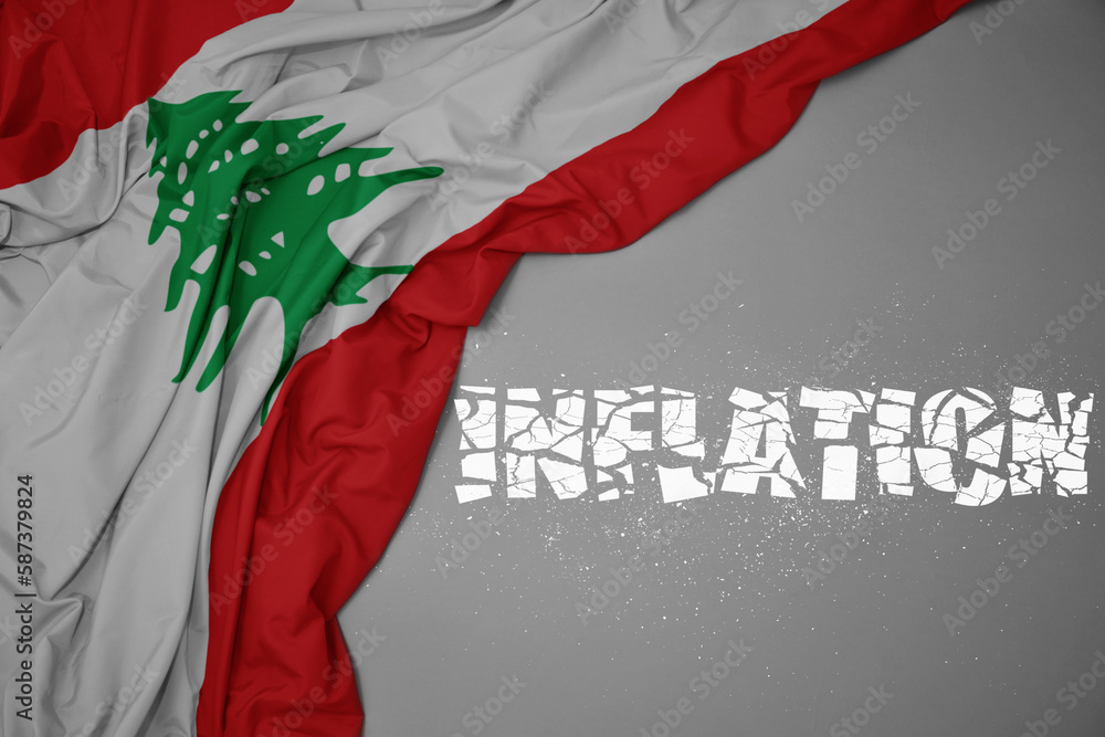 waving colorful national flag of lebanon on a gray background with broken text inflation. 3d illustration