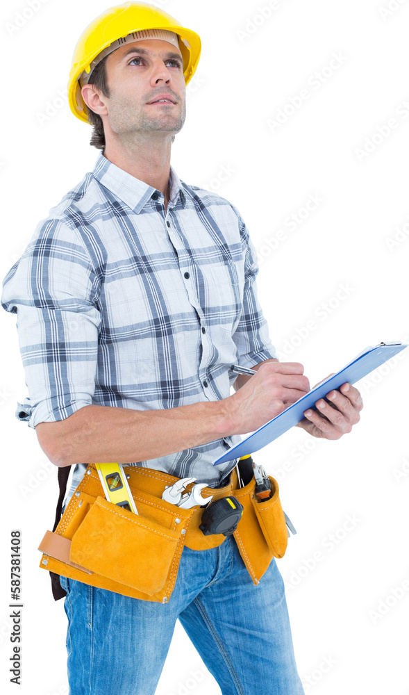 Handsome architect writing notes on clip board Handsome architect writing notes on clip board