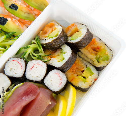 Sushi served in tray over white background
