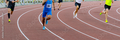 group male runners running track of stadium sprint race, athletics competition, summer sports games