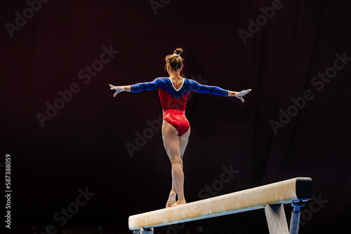 back female gymnast athlete balancing on balance beam gymnastics, sports summer games