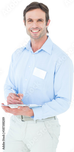 Portrait of confident supervisor writing notes on clipboard
