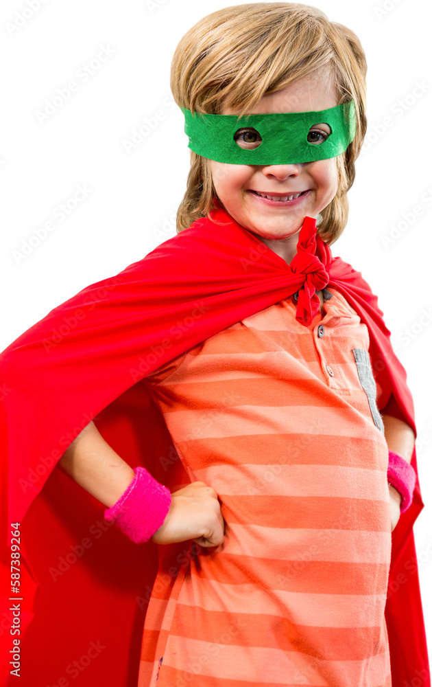 Boy standing with hands on hip in superhero costume