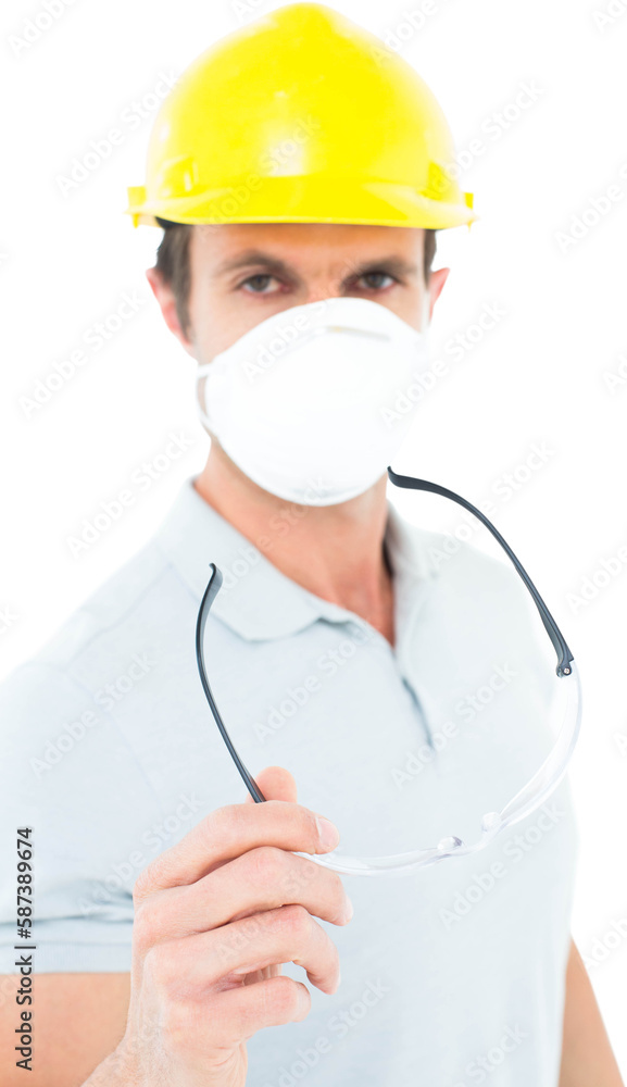 Worker wearing mask and hardhat while holding protective glasses Worker wearing mask and hardhat while holding protective glasses