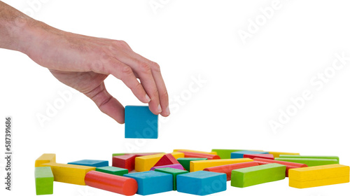 Cropped hand arranging colorful blocks