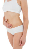 Fit woman suffering from stomach pain 