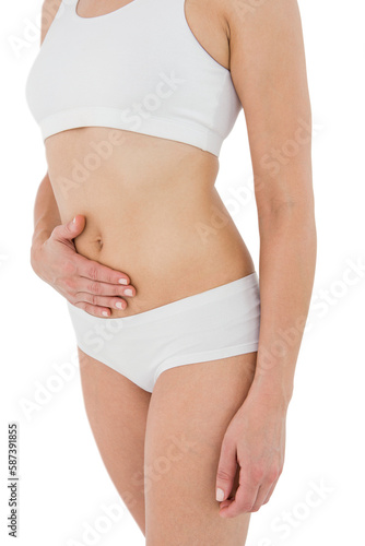 Fit woman suffering from stomach pain 