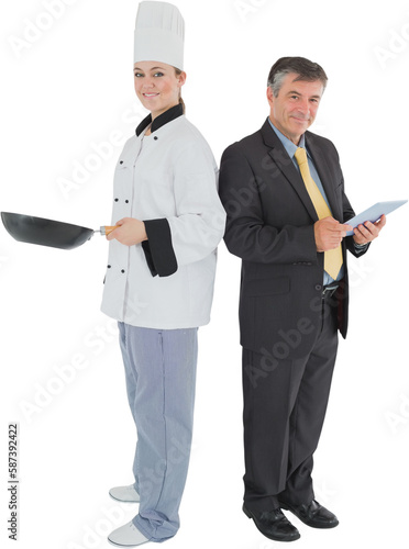 Businessman holding digital tablet and chef with frying pan