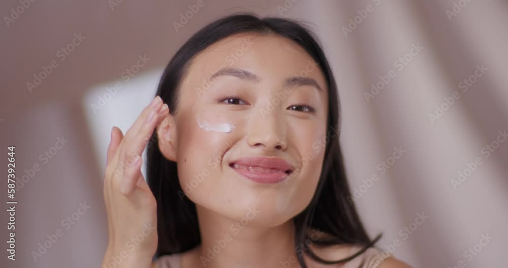 Beautiful Asian woman with brunette hair refreshing, using moisturizing face cream. Pretty woman smiling, good condition of skin after applying cream or hyaluronic acid. Nourishing face concept. Beautiful Asian woman with brunette hair refreshing, using moisturizing face cream. Pretty woman smiling, good condition of skin after applying cream or hyaluronic acid. Nourishing face concept.