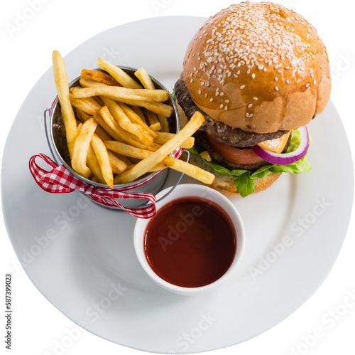 Burger, french fries and sauce on plate