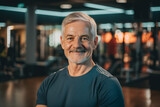 Portrait of a senior male with grey hair stood in a gym. Generative ai