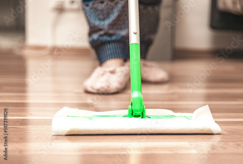Woman cleaning floor using mop at home, swob, house work, closeup
