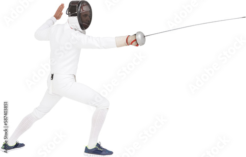 Man wearing fencing suit practicing with sword photo