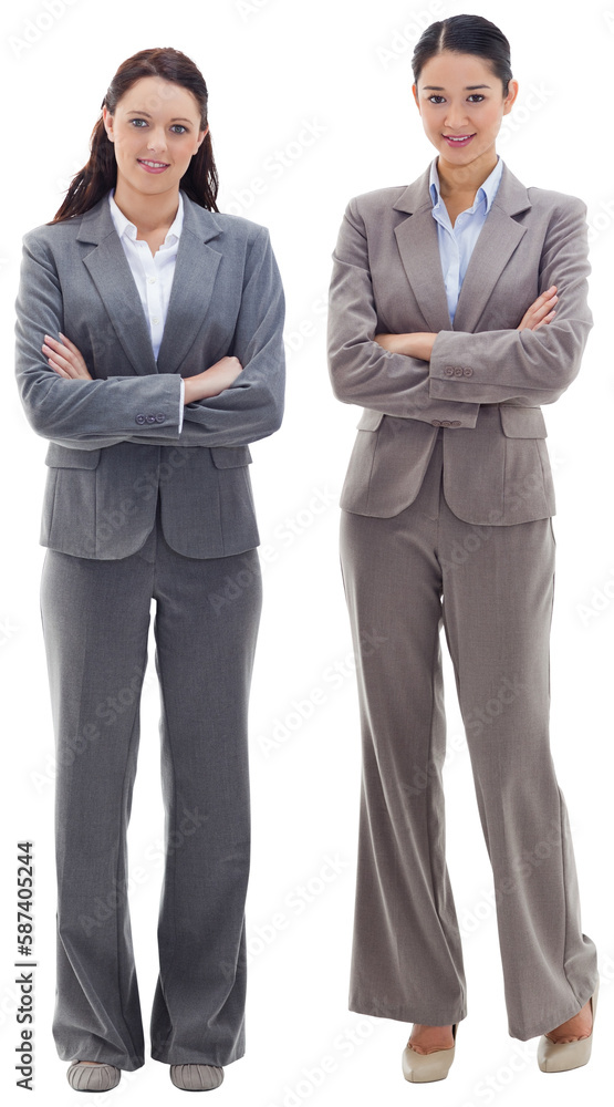 Two businesswomen with their arms crossed are smiling Two businesswomen with their arms crossed are smiling