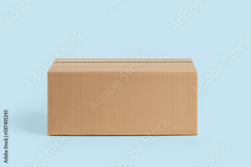 Cardboard box for delivery, parcels. On a blue, blue background © MM
