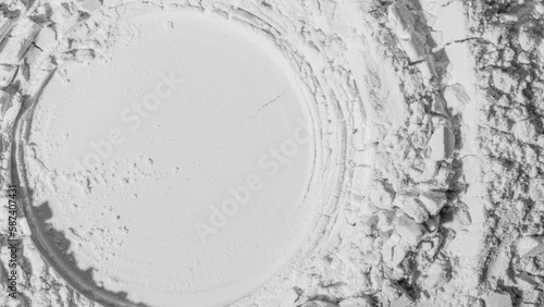 Texture of powder, flour, sand. White. extruded circle. Textured, cracked. White. Banner, advertising. Empty space. For an inscription. photo