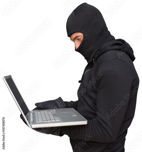 Side view of hacker using laptop