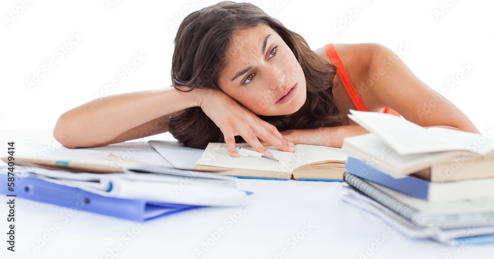 Bored female student doing her homework Bored female student doing her homework