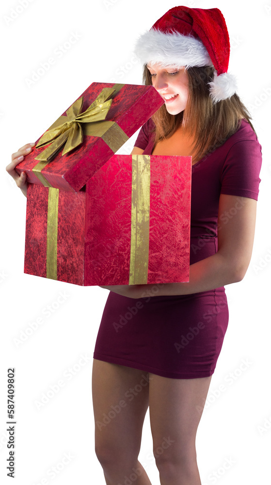 Smiling woman opening christmas present Smiling woman opening christmas present