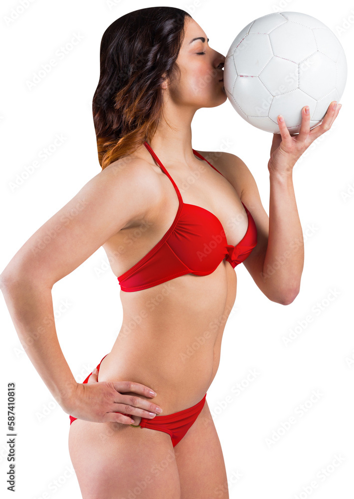 Brunette in bikini kissing football Brunette in bikini kissing football