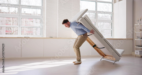 Men Carrying Furniture. Moving Sofa