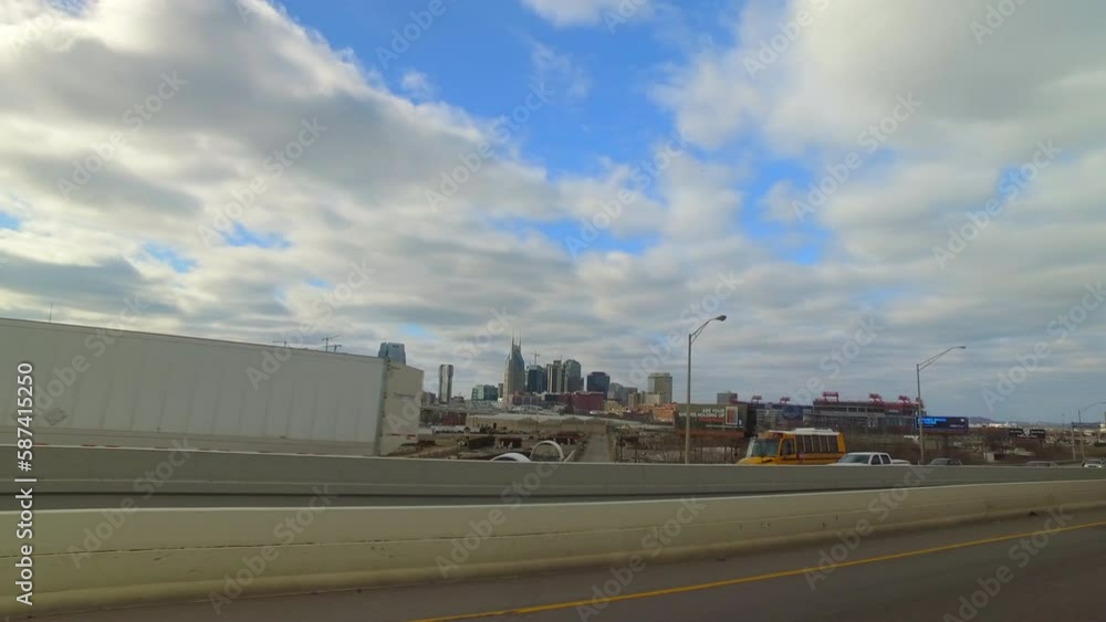 Pov Shot Of Cars Moving On Highway By City With Modern Buildings Against Cloudy Sky - Nashville, Tennessee Pov Shot Of Cars Moving On Highway By City With Modern Buildings Against Cloudy Sky - Nashville, Tennessee