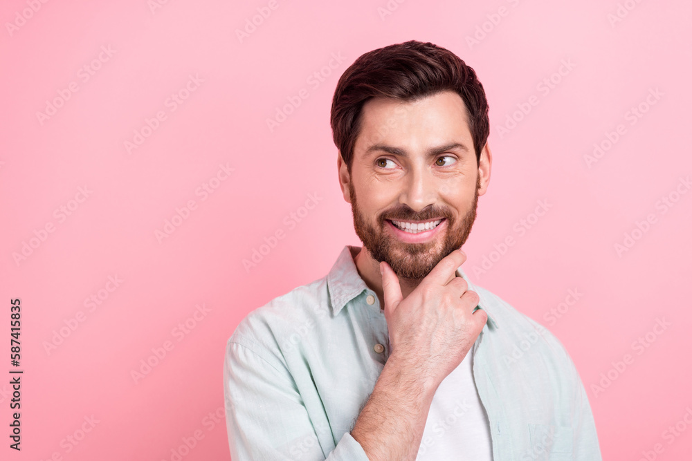 Portrait of young attractive model brunet hair man touch his bristle look empty space posing enjoy barbershop isolated on pink background Portrait of young attractive model brunet hair man touch his bristle look empty space posing enjoy barbershop isolated on pink background
