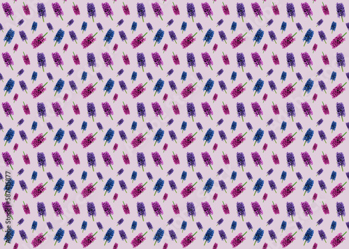 Seamless pattern with hyacinths of different colors and sizes on a light pink background. Floral spring pattern. Textile fabric design. Design for textiles, wallpapers.