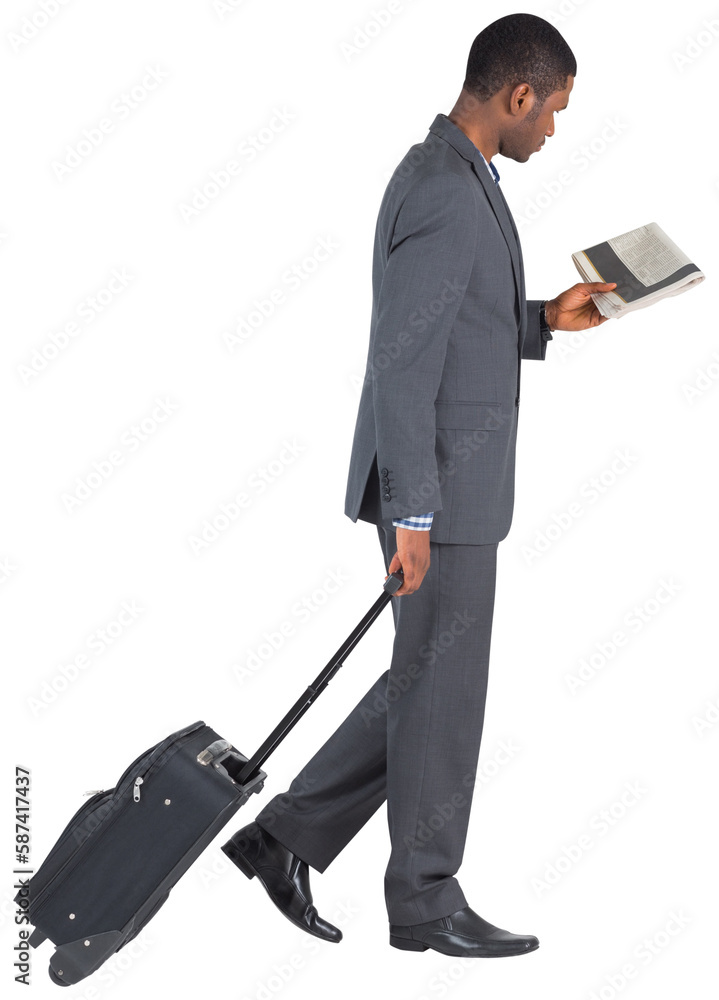 Young businessman pulling his suitcase Young businessman pulling his suitcase