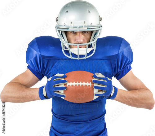 Portrait of confident sports player holding ball
