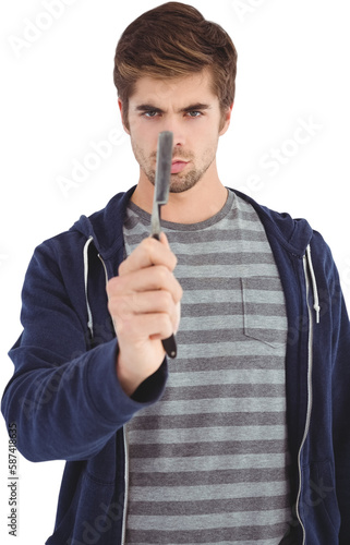 Portrait of man holding straight edge razor