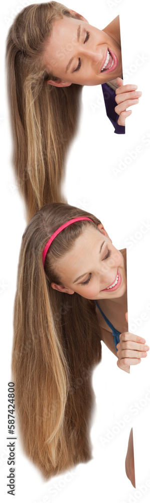 Close up of two smiling long hair students behind a blank sign