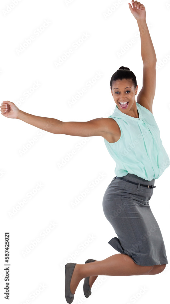 Excited businesswoman jumping with arms raised