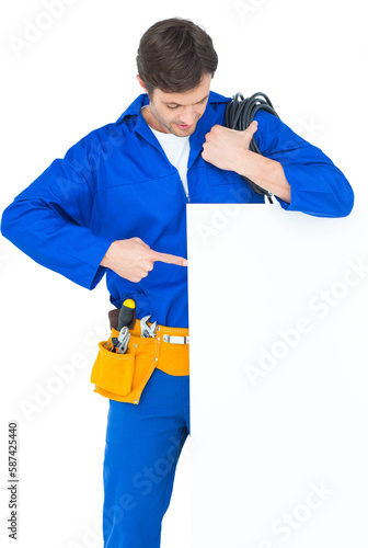 Electrician with wire pointing at bill board