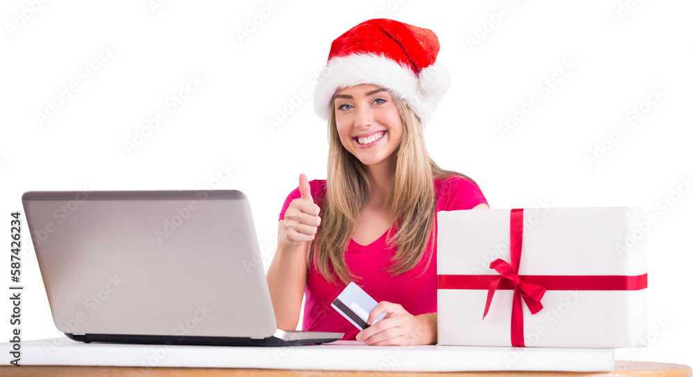 Festive blonde shopping online with laptop Festive blonde shopping online with laptop