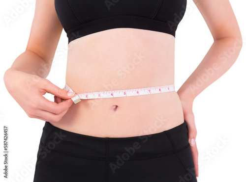 Fit woman measuring her waist