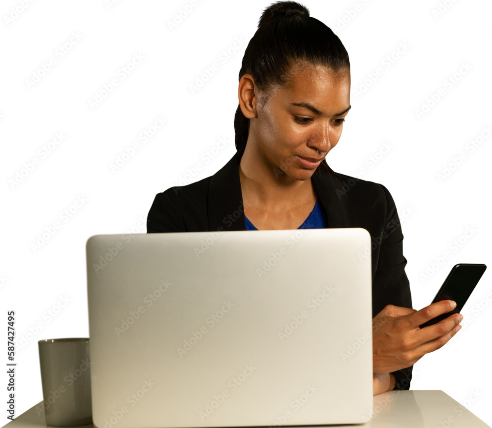 Woman using smartphone while using laptop