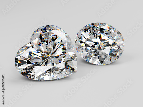 Two diamonds of round, heart brilliant cut on white background