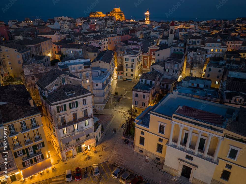 Aerial drone view of Corfu old town by night