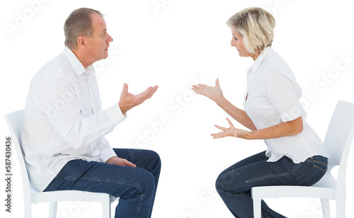 Fototapeta Naklejka Na Ścianę i Meble -  Older couple sitting in chairs arguing