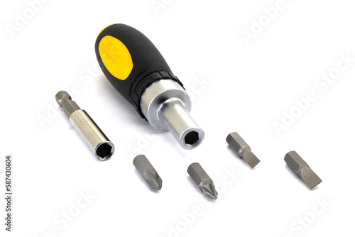 Screwdriver with interchangeable bits on white isolated background