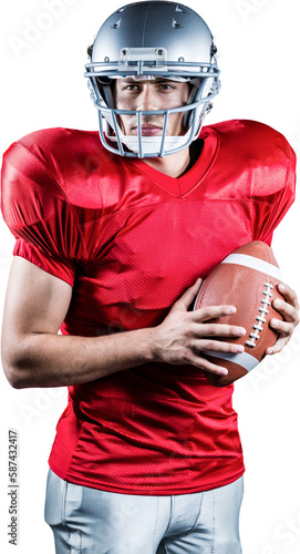 Confident American football player holding ball