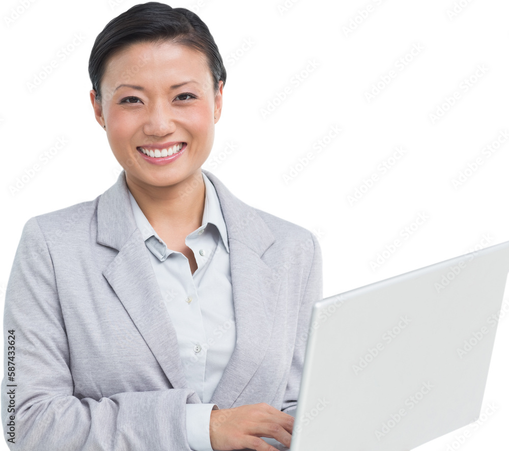 Businesswoman using laptop with colleagues behind Businesswoman using laptop with colleagues behind