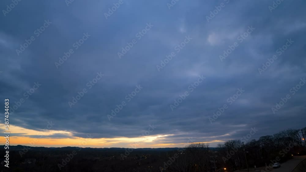 Aerial Lockdown Time Lapse Shot Of Fluffy Cloudscape Moving Over City Landscape During Sunset - Nashville, Tennessee