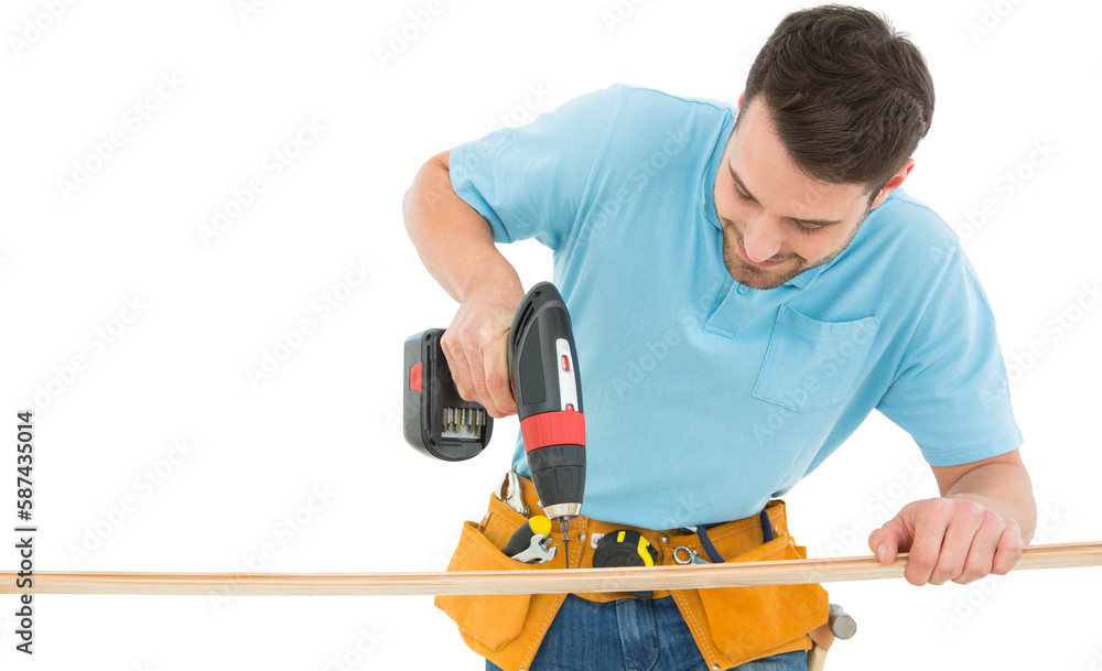 Construction worker using hand drill on wooden plank Construction worker using hand drill on wooden plank