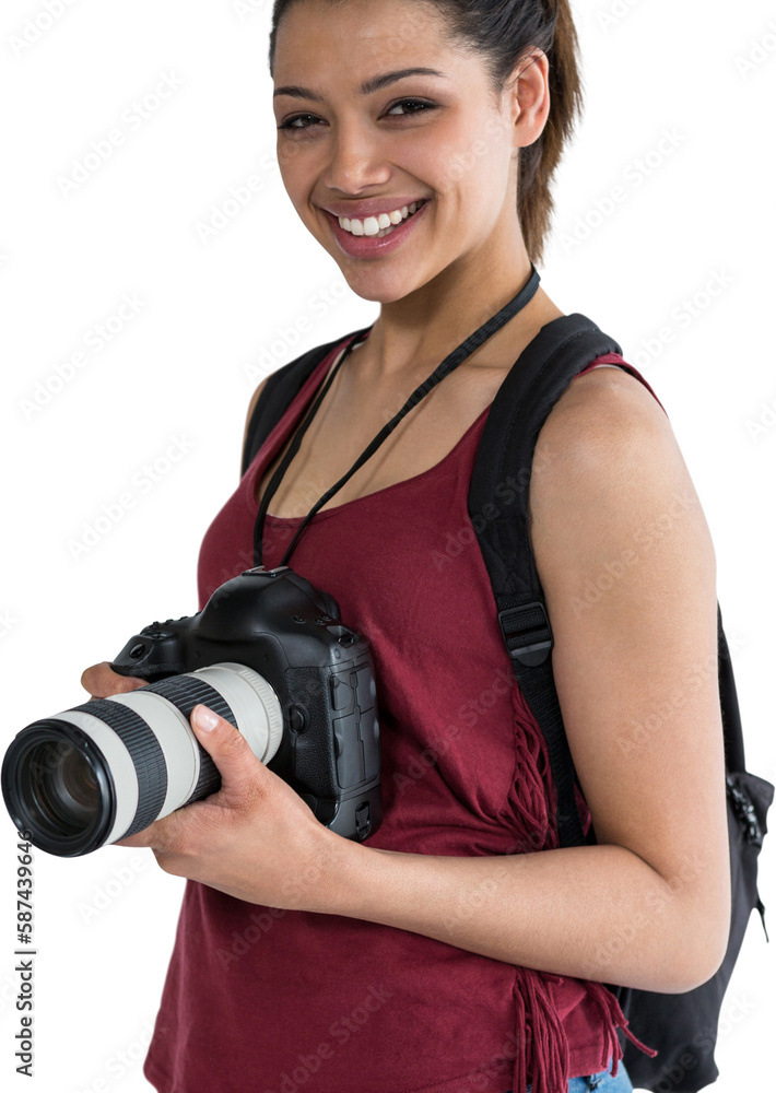 Portrait of smiling female photographer with digital camera