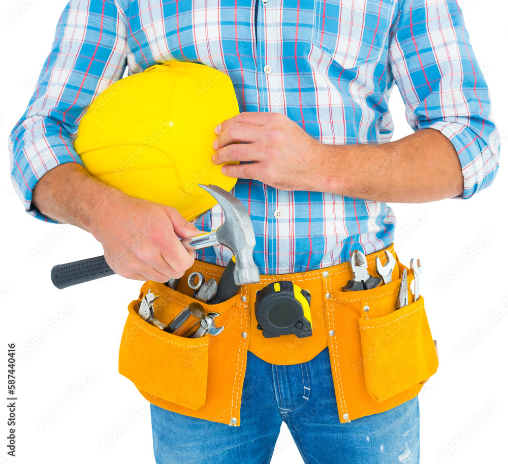 Manual worker wearing tool belt while holding hammer and helmet Manual worker wearing tool belt while holding hammer and helmet
