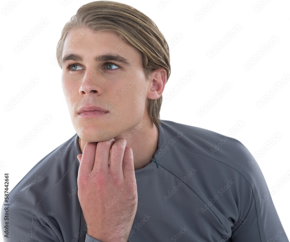 Thoughtful young businessman with hand on chin