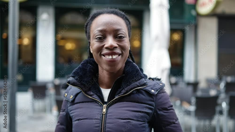 African american woman smiling confident standing at coffee shop terrace African american woman smiling confident standing at coffee shop terrace