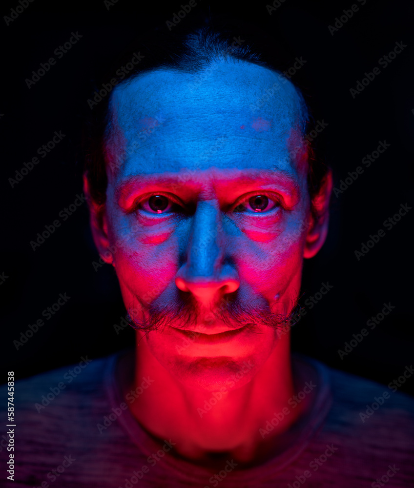 Bicolor portrait of a man, creative artistic light 